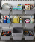 Six Pack Plastic Bus Tubs 8L Capacity For Restaurant And Food Service Use Durable Gray Totes organized on metal shelves.
