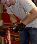 Man using Tough As Nails Straight Pneumatic Die Grinder at 25000 RPM for deburring task with sparks flying.