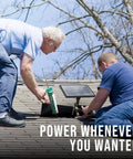 Two men installing Off-Grid 6V Solar Panel Charger For Deer Feeders And Gate Opener on rooftop