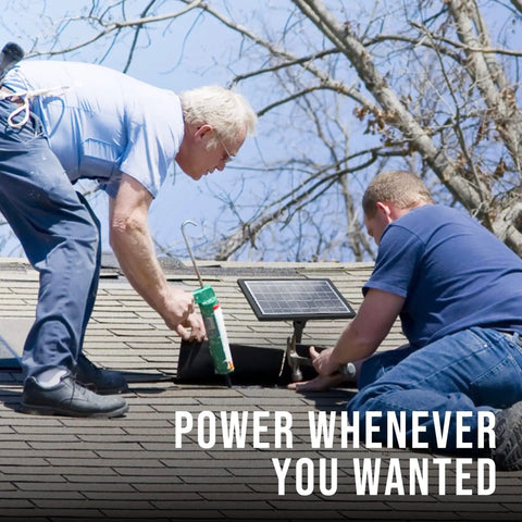 Two men installing Off-Grid 6V Solar Panel Charger For Deer Feeders And Gate Opener on rooftop