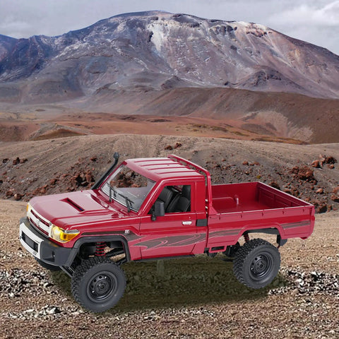 Red Toyota 1/12 Scale RC Rock Crawler Pickup Truck With 2.4GHz 4WD Off Road Remote Control on rocky terrain