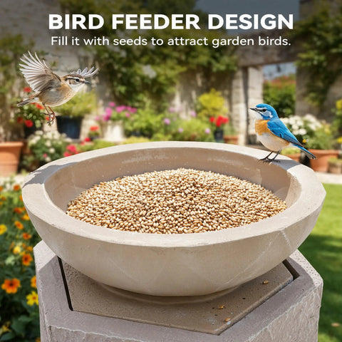 Bird feeder bowl filled with seeds on outdoor pedestal, blue and brown birds eating, garden background