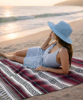 Woman on beach with Authentic Handmade Falsa Baja Blanket Soft And Lightweight Mexican Throw for yoga, beach, 70x50 Cherry