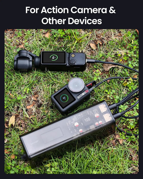 Drone Power Station With USB-C Fast Charging For DJI And More Portable 27000mAh 100Wh Power Bank charging camera on grass