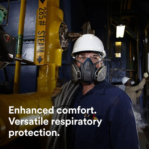 Worker wearing Rugged Comfort Quick Latch Half Facepiece Reusable Respirator 6501QL with silicone seal on industrial site.