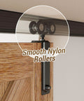 Ceiling Mount Box Rail Barn Door Hardware Kit with smooth nylon rollers on wooden door panel for quiet operation.