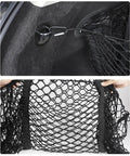 Hammock Style Three Compartment Cargo Net Made For Tesla Cybertruck 2024 Plus showing attachment clips and mesh fabric details.