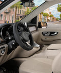Premium Black Microfiber Leather Steering Wheel Cover For Cars And Trucks Super Soft Anti Slip Grip in a vehicle interior.