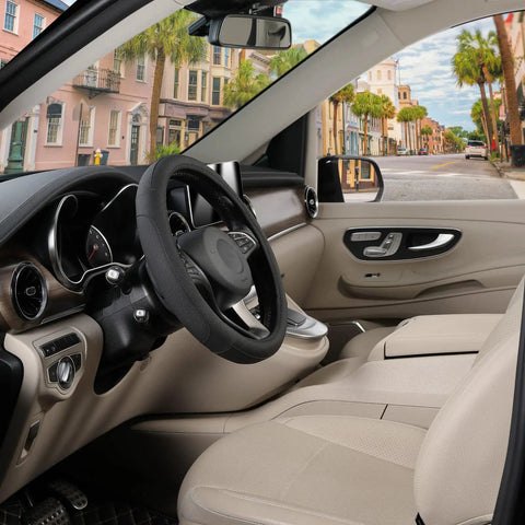Premium Black Microfiber Leather Steering Wheel Cover For Cars And Trucks Super Soft Anti Slip Grip in a vehicle interior.