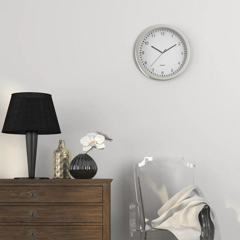 Room with 10 Inch Wall Clock Safe With Hidden Shelf Storage, battery operated analog timepiece, next to a lamp and chair.