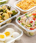 Glass Storage Containers With Lids Set For Meal Prep, 24 Piece Borosilicate Glass Food Storage, Leak Proof And Freezer Safe, 12 Containers And 12 Lids, Durable Clear Lunch Pack filled with various foods