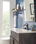 Bathroom with Westchester Single Hole Bathroom Faucet In Oil Rubbed Bronze With Ceramic Disc Technology on white vanity.