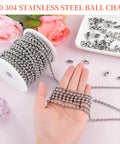 66 Foot Stainless Steel Ball Chain Kit 4.5mm Bead Chain With 100 Connectors And Pliers For Vertical Window Blinds Bead Roller Shade Chain Fan Pull Chain And DIY Jewelry Making Plus Rust Resistant 304 Stainless Steel Construction And Storage Spool displayed on a table with flowers.