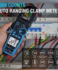 All In One Handy Clamp Meter Multimeter With Auto Ranging 6000 Counts True RMS in use with electrical panel