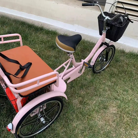 Hassle Free Fold Tandem Tricycle For Adults And Seniors With Rear Bucket Seat And Locking Safety Strap 20 Inch Front Wheel Heavy Duty Steel Frame Bright Pink Chill City Cruisers on grass.