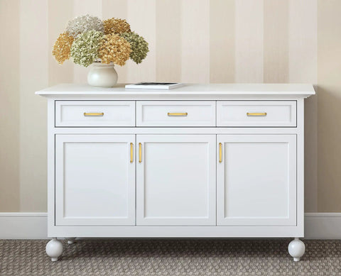 A Must Have Hella Sturdy Brushed Brass Cabinet Handles And Pulls With 5 Inch Center To Center Spacing For Kitchens And Drawers Features A Clean Look And Comes In A 30 Pack Bulk Set on a white cabinet.