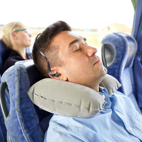 Man wearing 48 Pieces Banded Ear Plugs With Neck Band Silicone Hearing Bands For Shooting, Noise, Sleeping, Studying And Construction on bus
