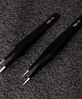 Pro Grade ESD Safe Tweezers Set, 2 of 7 Piece Stainless Steel Anti Static Precision Tweezers with Black Finish on textured surface.