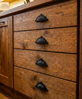 Wooden drawers with Matte Black Cup Drawer Pulls for Cabinets and Kitchen, Mystic Colonial Style Flat Black Cabinet Handles