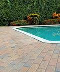 Premium Two Part Urethane Paver Sealer That Kicks Up Rich Outdoor Stone Color And Shields Concrete Patios With A Durable Semi Gloss Protective Finish That Goes The Distance applied on a patio near a pool.