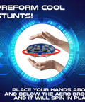 Self-Flying Aero Drone 360 For Kids With Hand Command Control performing spin stunt between hands.