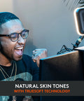 Person using Litra Glow Premium LED Streaming Light With TrueSoft Skin Tone For Crisp Video Calls at desk with headset and monitor.