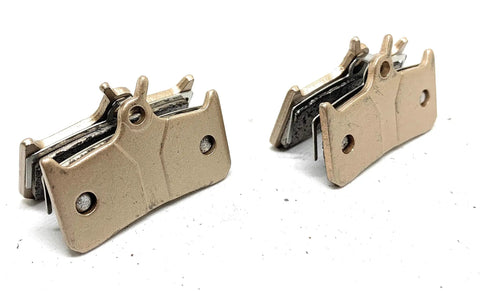 Heavy Duty Sintered Metal Disc Brake Pads In Two Pairs, showcasing rugged design for Shimano Grimeca and Hope rotors.
