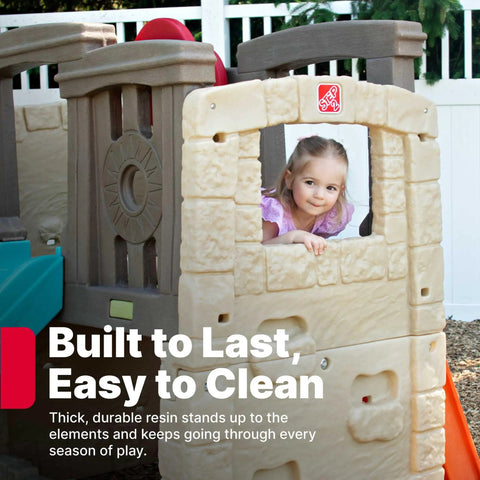 Child playing in Woodland Climber II Kids Playset with durable plastic frame and hideout, showcasing easy setup for backyard fun.