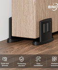 Super Slick 2 Pack Sliding Barn Door Floor Guide With Heavy Duty Aluminum Track Rollers Featuring Dual Sided Concealed Pulleys For Smooth As Butter Gliding And Corrosion Resistant Black Finish For No Sweat Install, installed near wooden door.