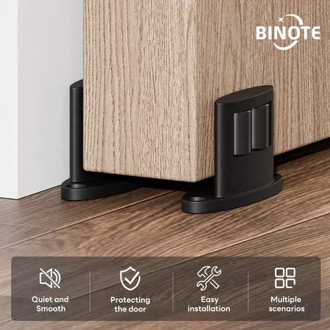 Super Slick 2 Pack Sliding Barn Door Floor Guide With Heavy Duty Aluminum Track Rollers Featuring Dual Sided Concealed Pulleys For Smooth As Butter Gliding And Corrosion Resistant Black Finish For No Sweat Install, installed near wooden door.