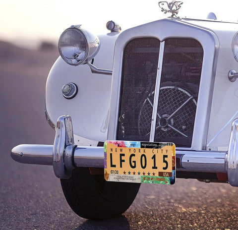 Close-up of a classic car with Dope Universal Stainless Steel License Plate Frame For Car With Screws, standard US plate 12x6 inch