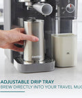 Top Shelf Hassle Free One Touch Espresso And Latte Brewer With Built In Frother brewing into a stainless steel travel mug.