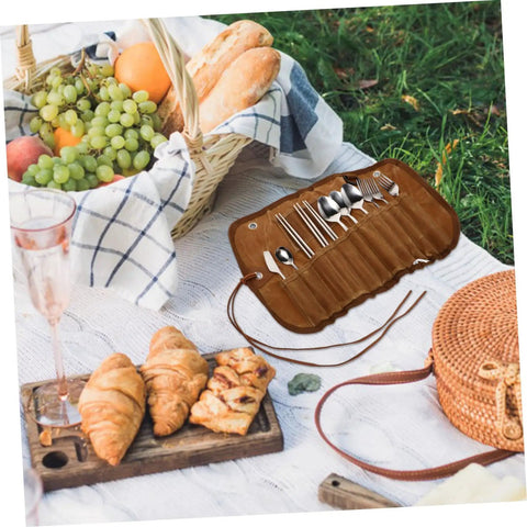 Outdoor Dining Kit Stainless Steel Camping Tableware Set With Spoons Forks And Knives in brown pouch on picnic blanket