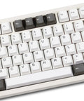 Badass Cnc Aluminum Mechanical Keyboard Featuring Smooth Triple Mode Wireless Connectivity Quick Release Design And Dope Hot Swap Pbt Keycaps showing white and black keycaps from a top view.