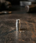 16 Piece Long Bearing Spacers Roller Skate Axle Sleeve Kit silver aluminum spacer standing on workbench