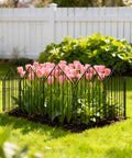 Rustproof Metal Garden Fence 17 Inch By 10 Feet No Dig Animal Barrier Ten Panel Set installed around flower bed with pink tulips