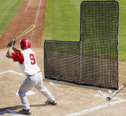 7x7 Foot Baseball Softball L Screen for Pitcher Safety with Wheels in use during practice on a baseball field
