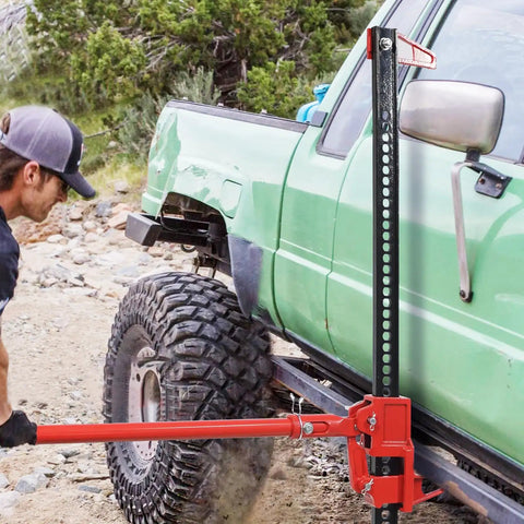 Heavy Duty Farm Jack 7000 Lb Capacity 48 Inch Ratcheting Utility Jack lifting a truck on rugged terrain
