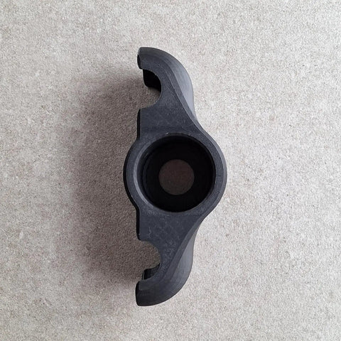 Top view of a single adapter from 4 Pack Indoor Cycling Snap Rocker Feet Adapters With Eight Tennis Balls For Stability On Smart Bike
