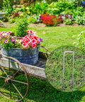 Heavy Duty 12 Inch Garden Stakes Pins Pro Grade 11 Gauge Galvanized Steel Landscape Staples in garden with flowers