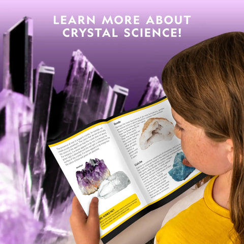 Child reading guide about crystals with backdrop of purple crystals; Mega Crystal Growing Kit For Kids Grow 6 Colorful Crystals With Light Up Stand Fast Growing Kid Friendly Science Gift For Ages 8 To 12 Crystal Making Experiment For Girls And Boys in use
