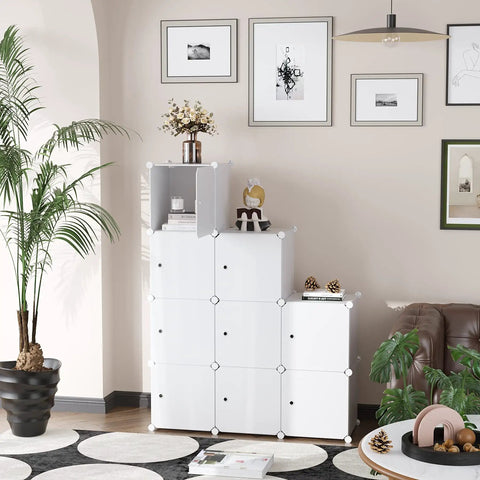 9 Cube Storage Organizer With Doors For Bedroom And Living Room, modular white bookshelf, decor and plants around