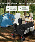 Collapsible Utility Wagon With Extra Deep Seven Cubic Feet Of Space 400 Pound Capacity Heavy Duty Foldable Beach Cart With Large Wheels And Pockets Perfect For Sand Garden Camping Or Grocery Hauls loaded with camping gear next to a tent.