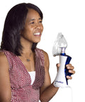 Person using New Classic Handheld Personal Steam Inhaler Vaporizer And Humidifier with plastic mask attached.