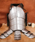 Beefy 18 Gauge Medieval Cuirass Armor With Tassets For LARP And Cosplay Full Chest Groin And Hip Protection displayed on fur rug.
