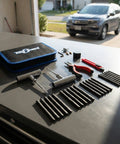 Badass Heavy Duty 31 Piece Flat Tire Repair Kit With Durable Rubber Plugs And Complete Steel Tool Set For Cars Trucks ATV Jeep with tools laid out.