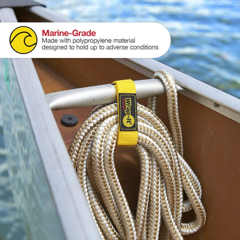 Yellow quick strap securing rope on a boat with marine-grade material label