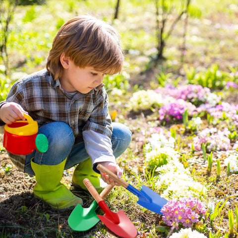 Child using 12 Pack Kids Garden Shovels Set With Wooden Handles, Mini Metal Sand Shovels for Beach and Garden, toy tools in garden