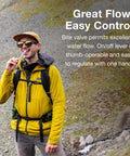 Person using 3L Hydration Reservoir For Backpacks With Bite Valve, BPA Free Leakproof Hydration Bladder on hiking trail.
