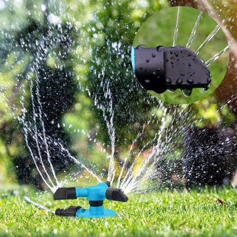 Three-arm 360 degree rotating lawn sprinkler in use, showing water spray pattern. Durable ABS construction, half inch connector.